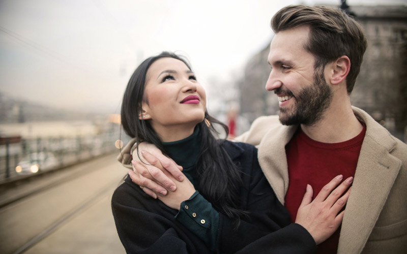 Showing excessive affection toward one another as a newlywed couple